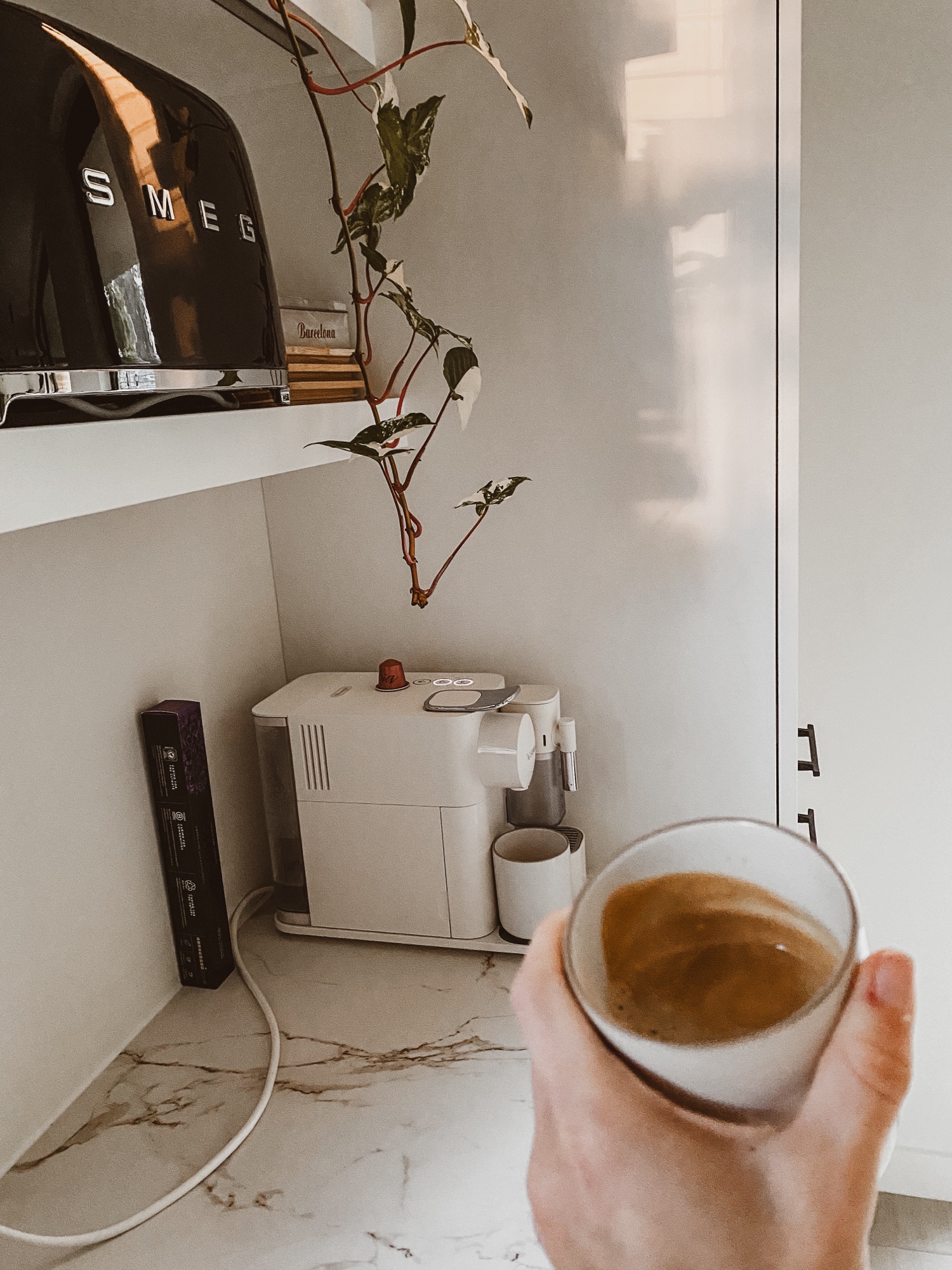 Enjoying a hot cup of Nespresso coffee with my Lattissima machine on the beautiful Dekton Entzo stone in our new off-white kitchen